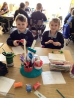 Year 4/5 using their modelling skills to create a clay ‘red eyed tree frog’ as part of their rainforest topic