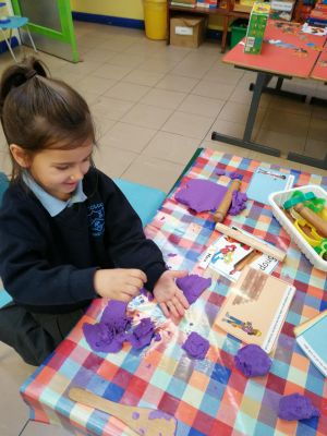 Mara is making playdough bricks